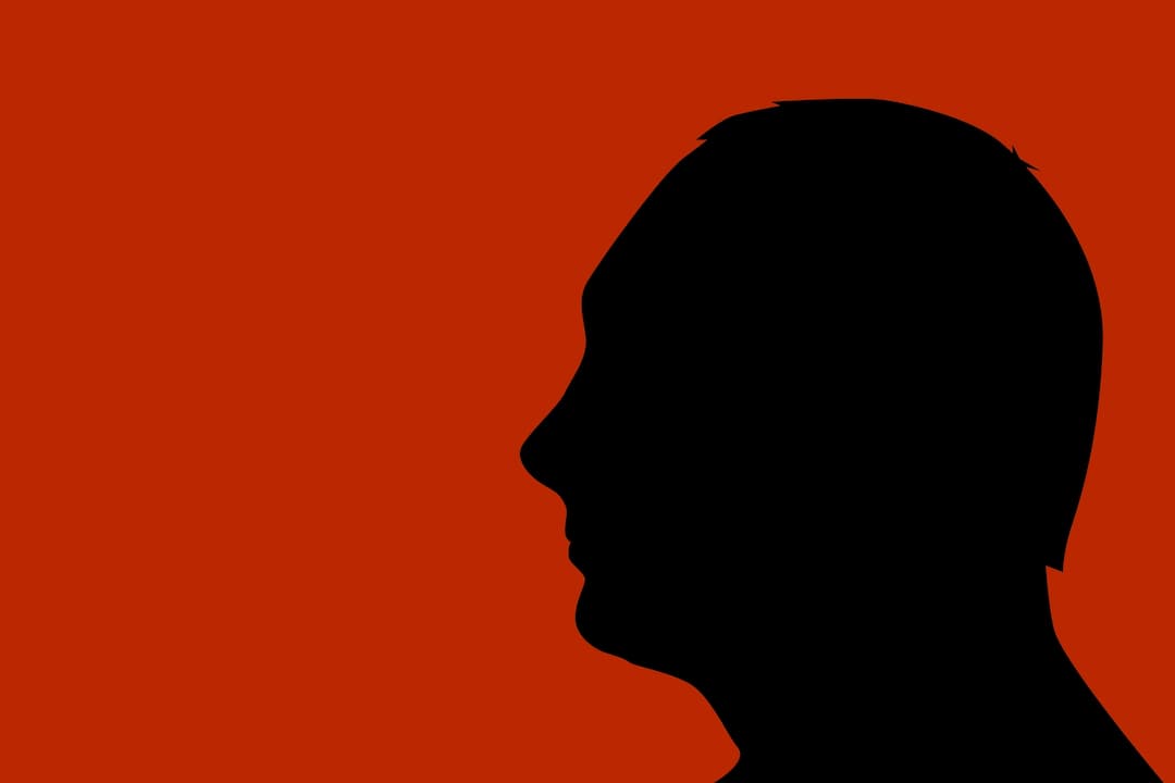 Vladmir Putin silhouette in a red background